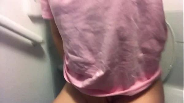 A young beauty masturbates in the toilet of an airplane.