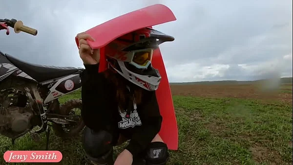 Naked woman riding a Dirt Bike