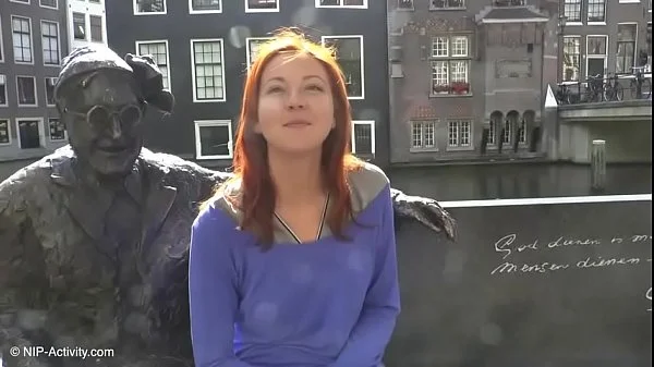 Pretty redhead walking naked in Amsterdam