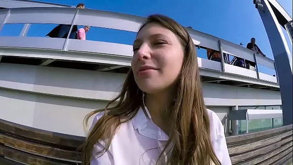 Talia Mint plays in public with remote control toy over the phone with fan